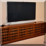 F20. Long media cabinet with sliding doors. 27”h x 96”w 
